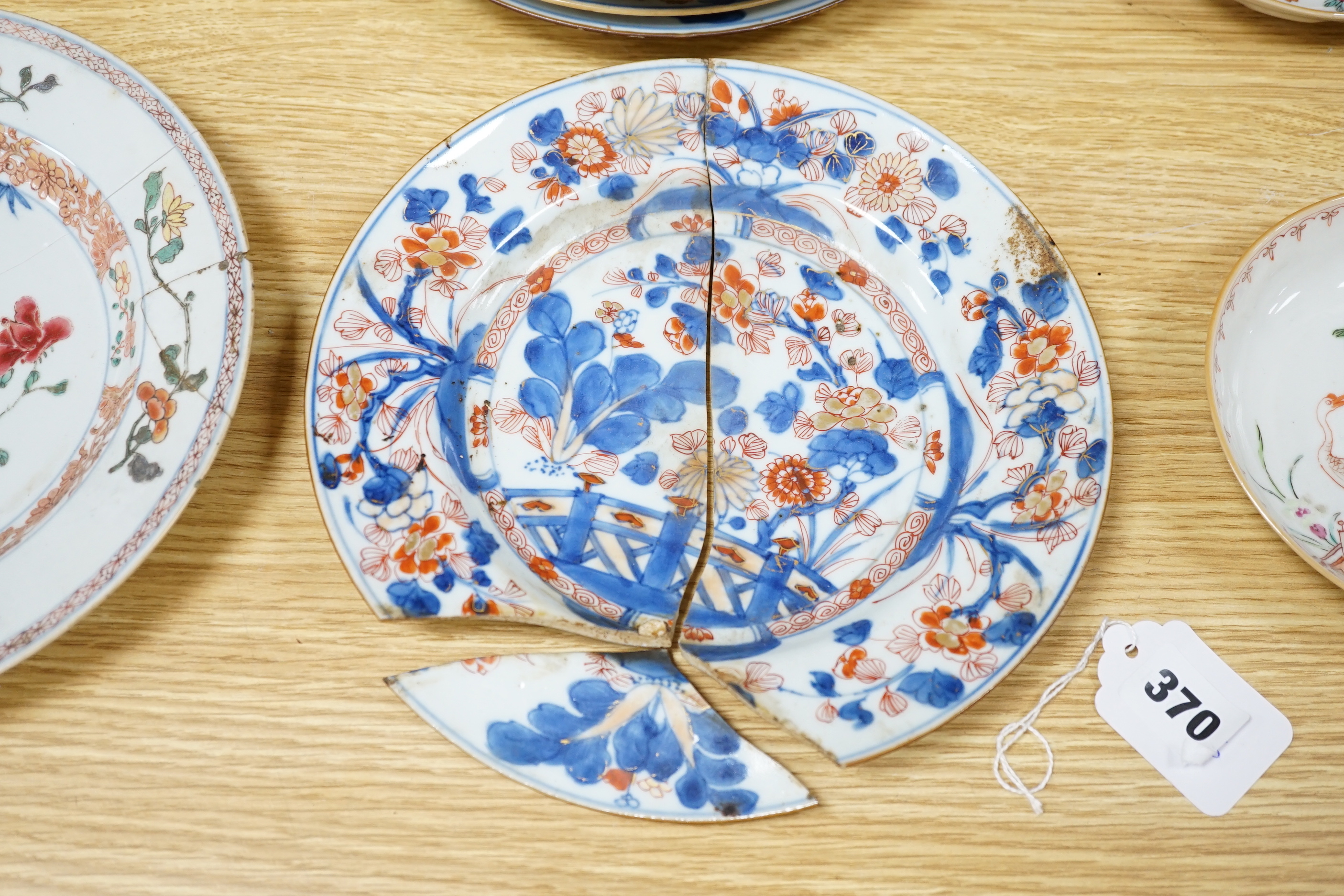 A collection of 18th century Chinese export plates and saucers